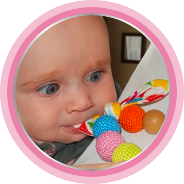 Baby playing with colorful toy